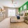 South Asheville, NC, Apartments with In-Unit Washer and Dryer - Weirbridge Village - Bedroom with Oversized Closet, Ceiling Fan, Plush Carpet with a Large Window, and a Bed and Dresser