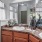 One-Bedroom Apartments in South Asheville, NC - Weirbridge Village - Bathroom with Double Vanity, Shower and Tub Combo, a Large Mirror, and Oversized Closet